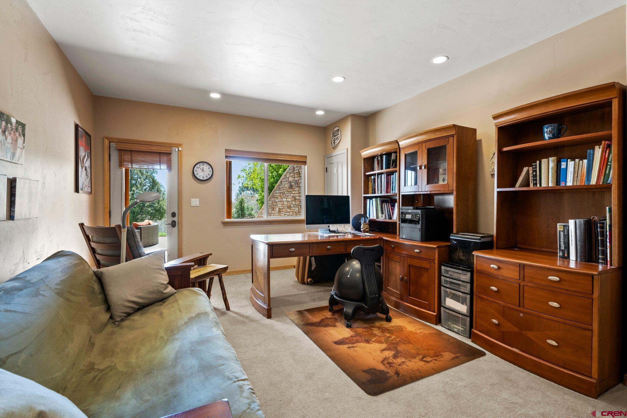 50 West Durango Ridge Road Durango, CO 81301 - Photo 36 of 45 a work room with furniture a bookshelf and a window