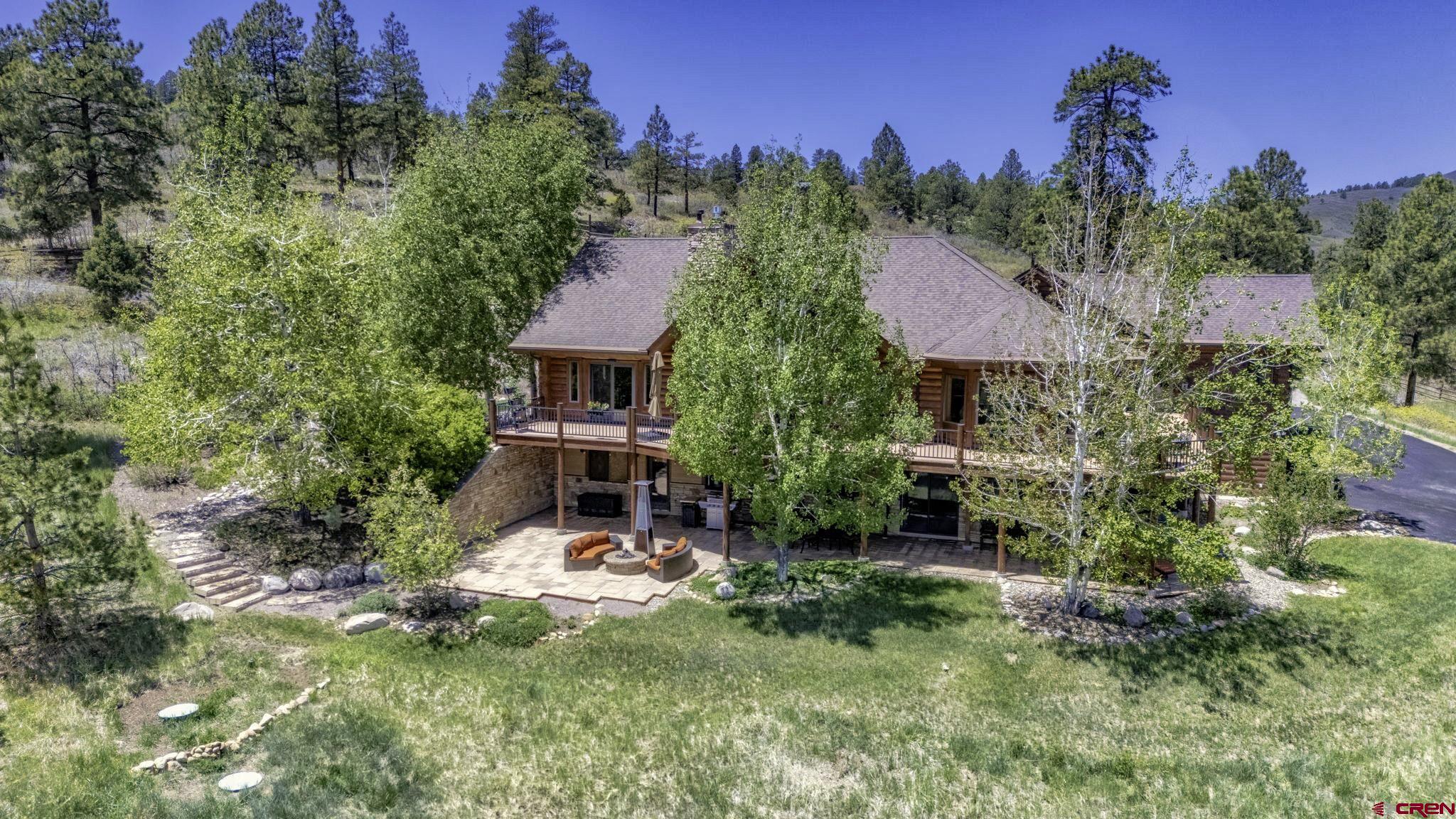 50 West Durango Ridge Road Durango, CO 81301 - Photo 37 of 45 a view of a house with a yard and sitting area