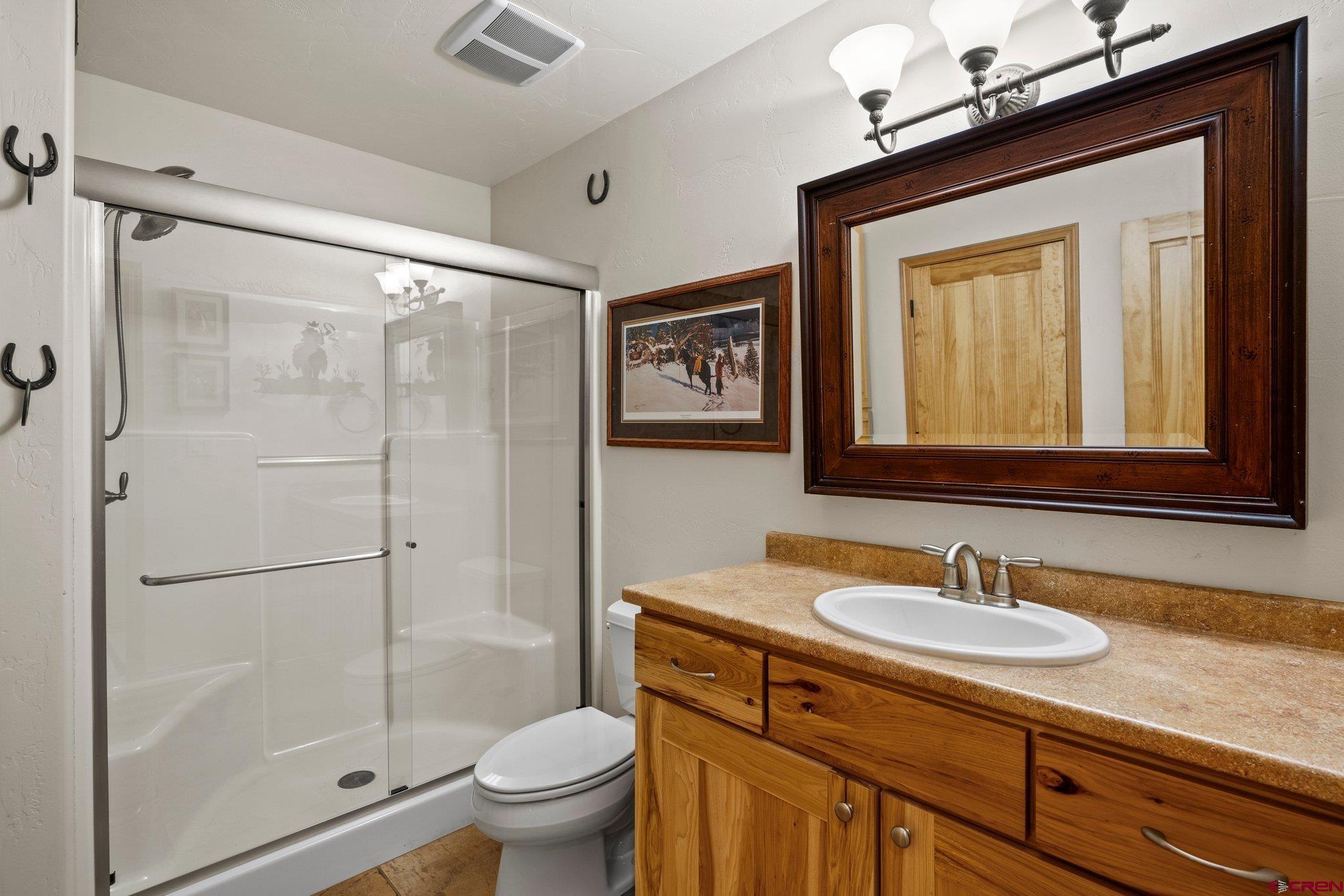 50 West Durango Ridge Road Durango, CO 81301 - Photo 39 of 45 a bathroom with a sink a toilet and shower