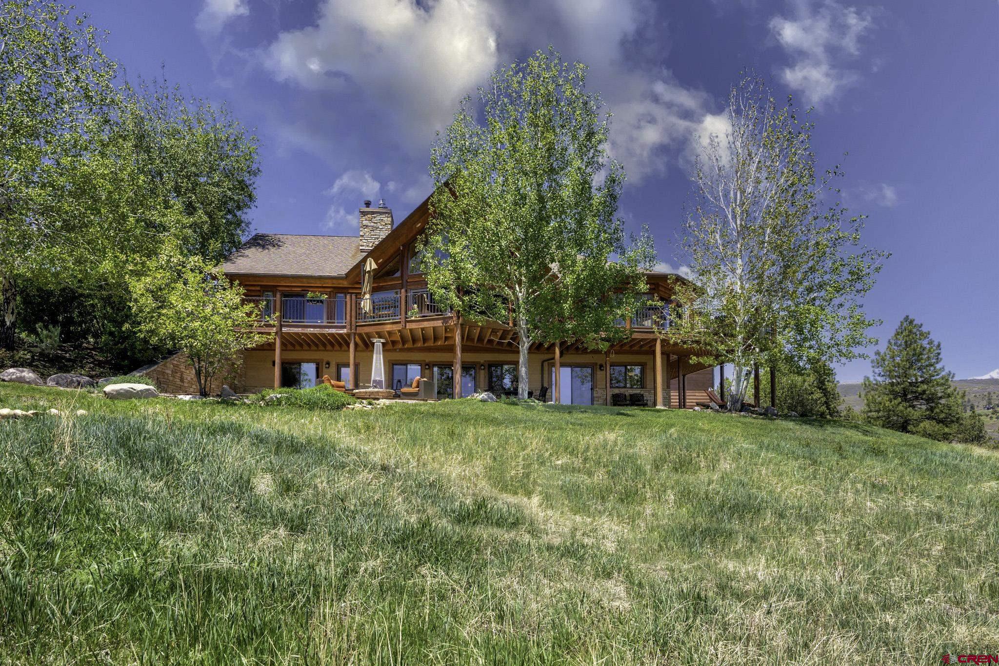 50 West Durango Ridge Road Durango, CO 81301 - Photo 40 of 45 a front view of a house with a yard and trees