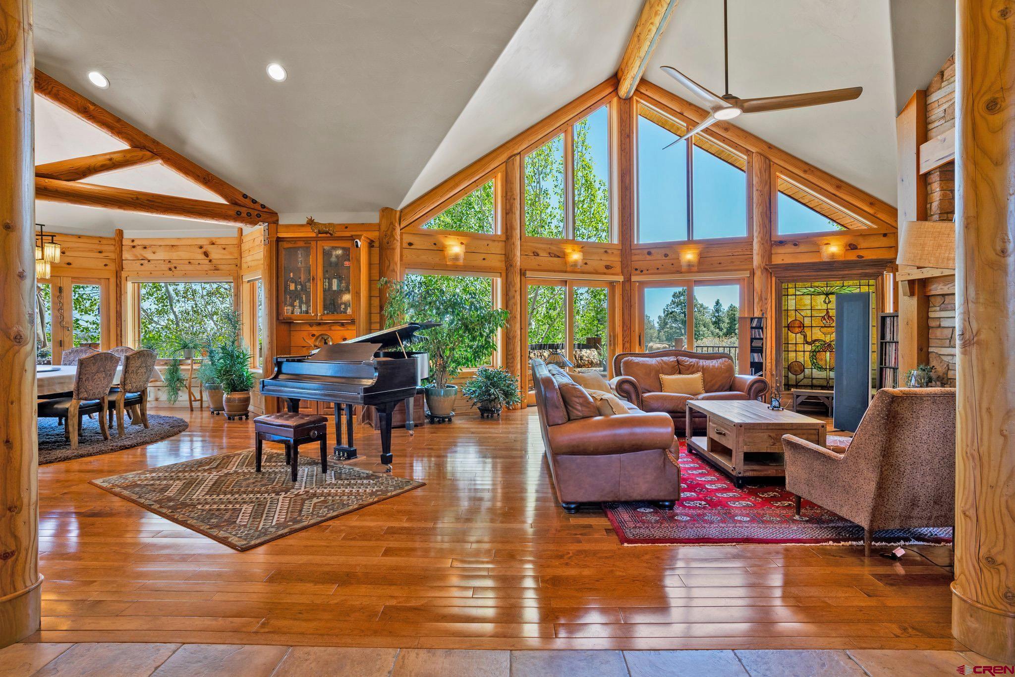 50 West Durango Ridge Road Durango, CO 81301 - Photo 8 of 45 a living room with furniture a rug wooden floor and a large window