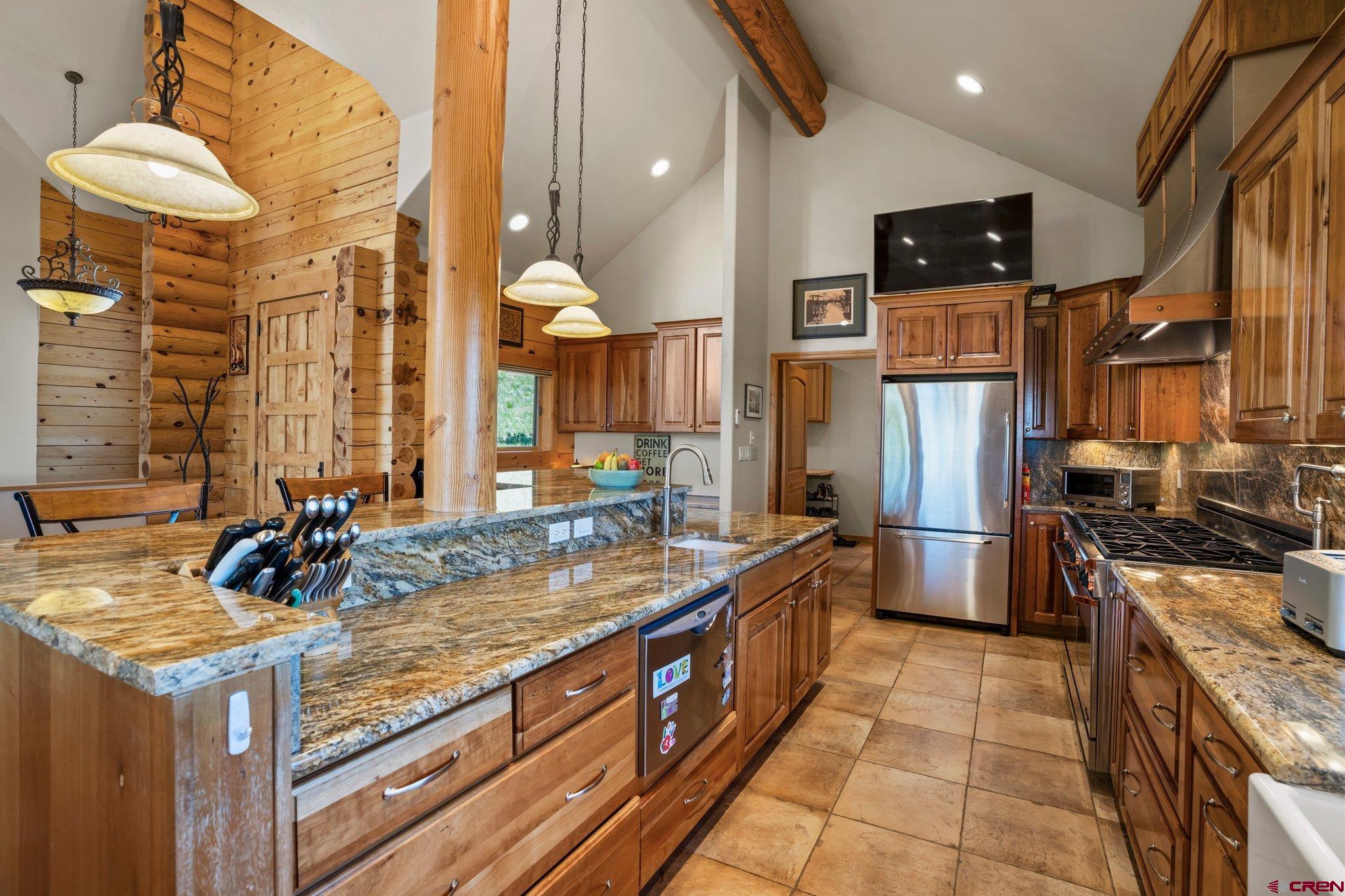 50 West Durango Ridge Road Durango, CO 81301 - Photo 10 of 45 a kitchen with stainless steel appliances granite countertop a sink a stove and a refrigerator