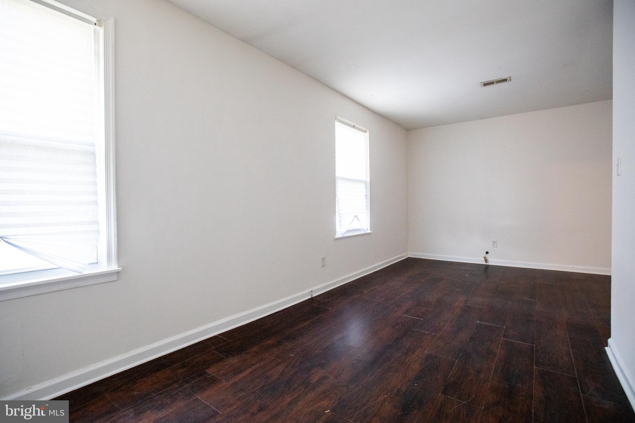 43 Fairmount Avenue Sicklerville, NJ 08081 - Photo 17 of 24 an empty room with wooden floor and windows