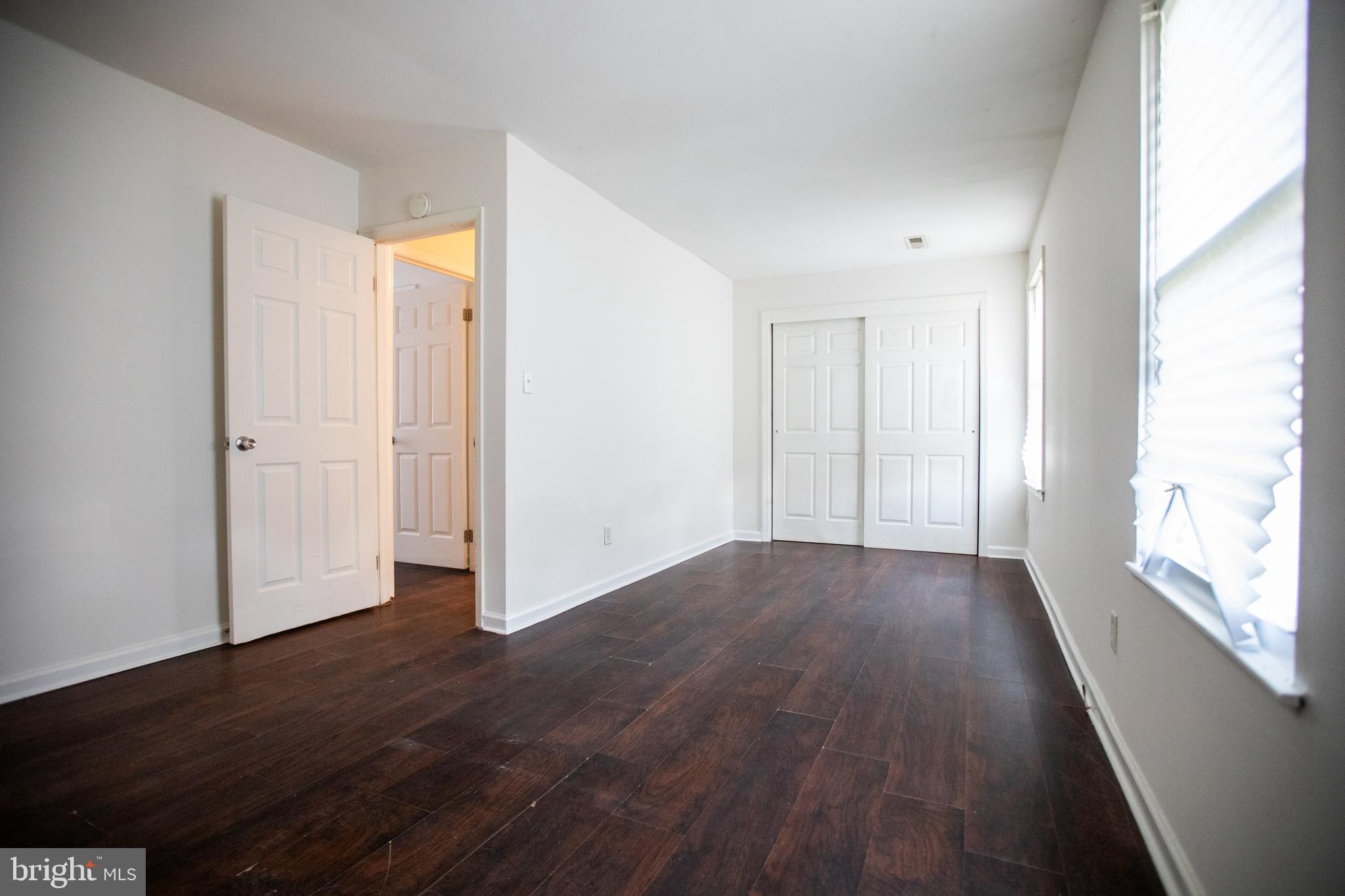 43 Fairmount Avenue Sicklerville, NJ 08081 - Photo 18 of 24 an empty room with wooden floor and windows