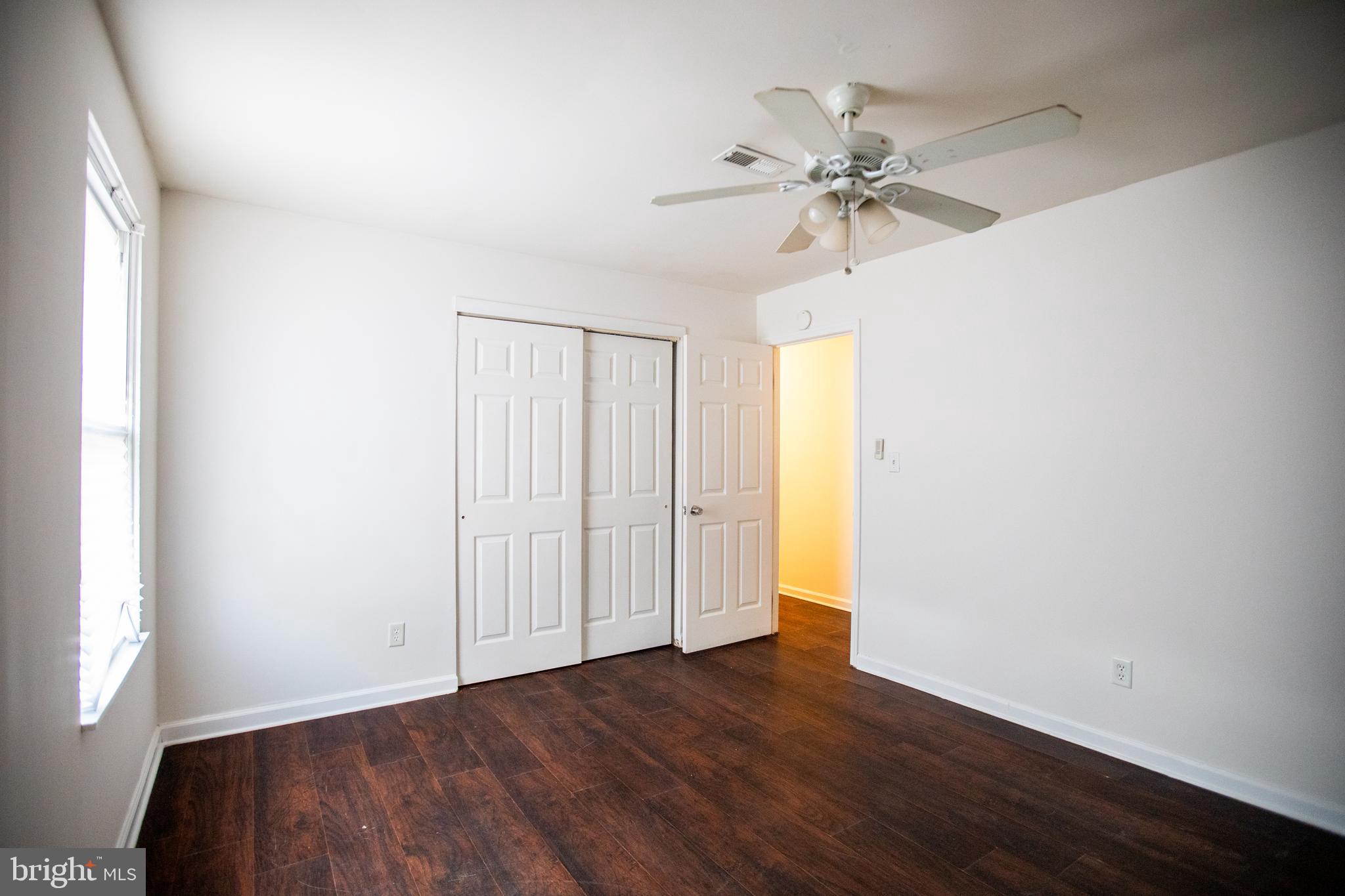 43 Fairmount Avenue Sicklerville, NJ 08081 - Photo 19 of 24 wooden floor in an empty room with a window