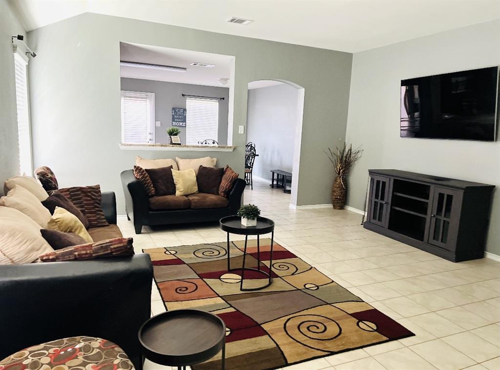 2302 San Marcos Drive Forney, TX 75126 - Photo 7 of 27 a living room with furniture and a flat screen tv