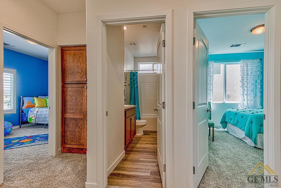 Undisclosed Address Bakersfield, CA 93311 - Photo 8 of 12 a view of a hallway with living room and furniture