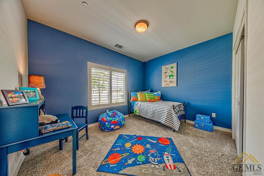 Undisclosed Address Bakersfield, CA 93311 - Photo 9 of 12 a room with toys and a wooden floor