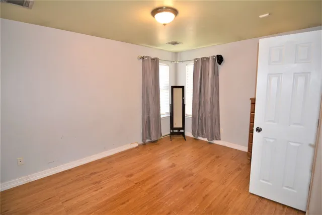 a bathroom with a sink vanity mirror and toilet