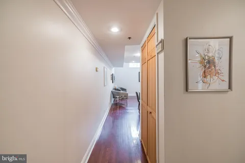 a view of staircase with white walls and a window