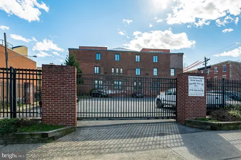 a front view of a house with parking space