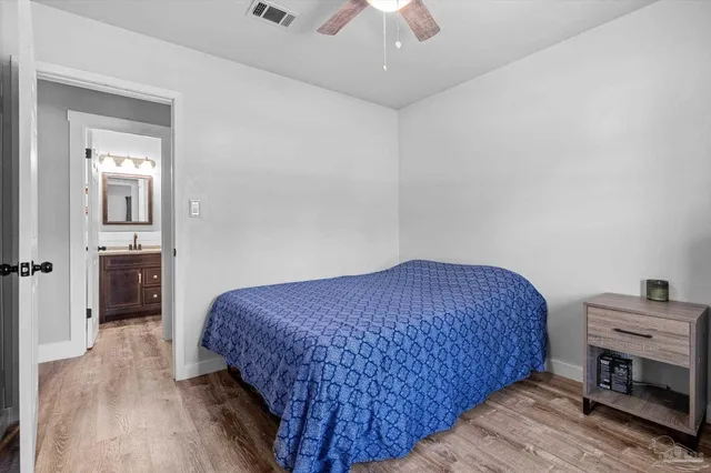 a bathroom with a sink toilet and mirror