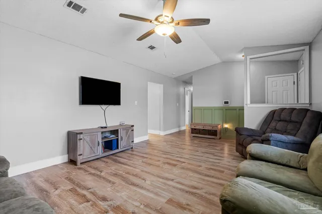 a kitchen with granite countertop white cabinets white appliances and sink