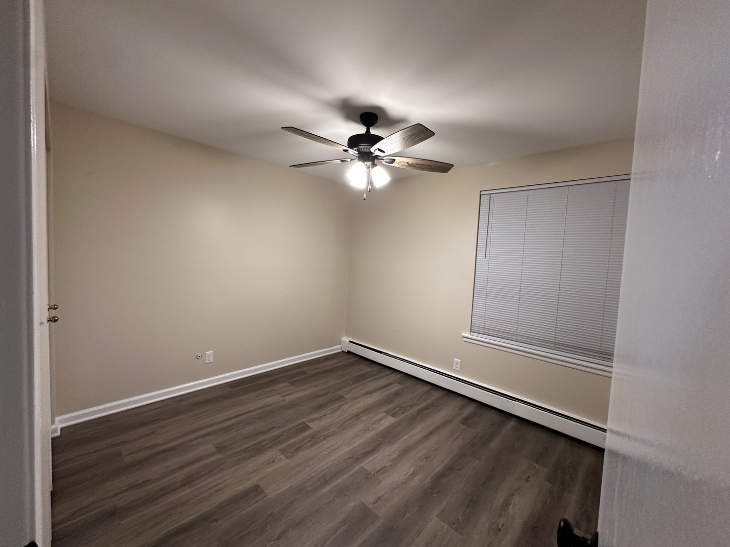 2500 Light Road, Unit 106 Oswego, IL 60543 - Photo 14 of 15 wooden floor in an empty room with a window