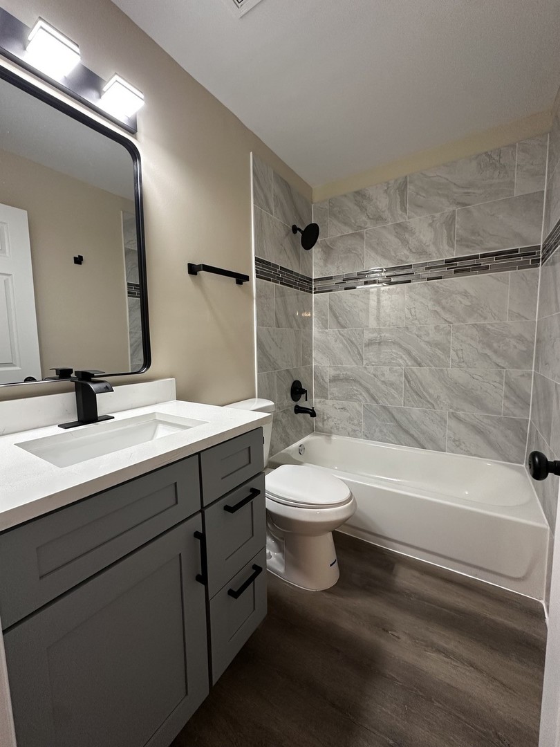 2500 Light Road, Unit 106 Oswego, IL 60543 - Photo 15 of 15 a bathroom with a sink a toilet and shower