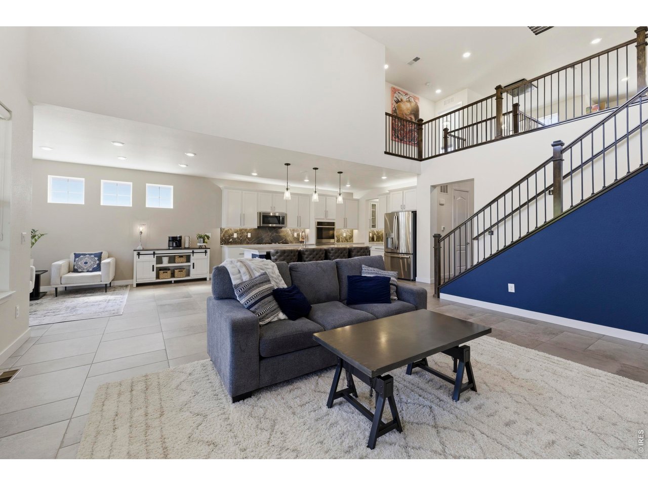 2910 Water View Street Timnath, CO 80547 - Photo 8 of 50 a living room with furniture and kitchen view