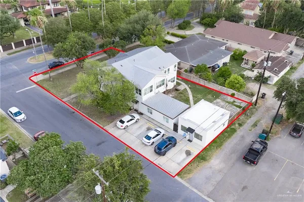 an aerial view of a house with outdoor space