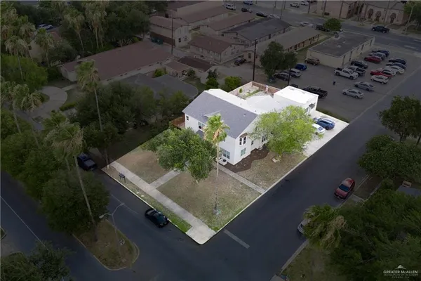 an aerial view of house with yard