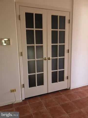 a kitchen with white cabinets and a stove