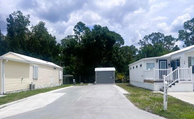 a view of a back yard of the house