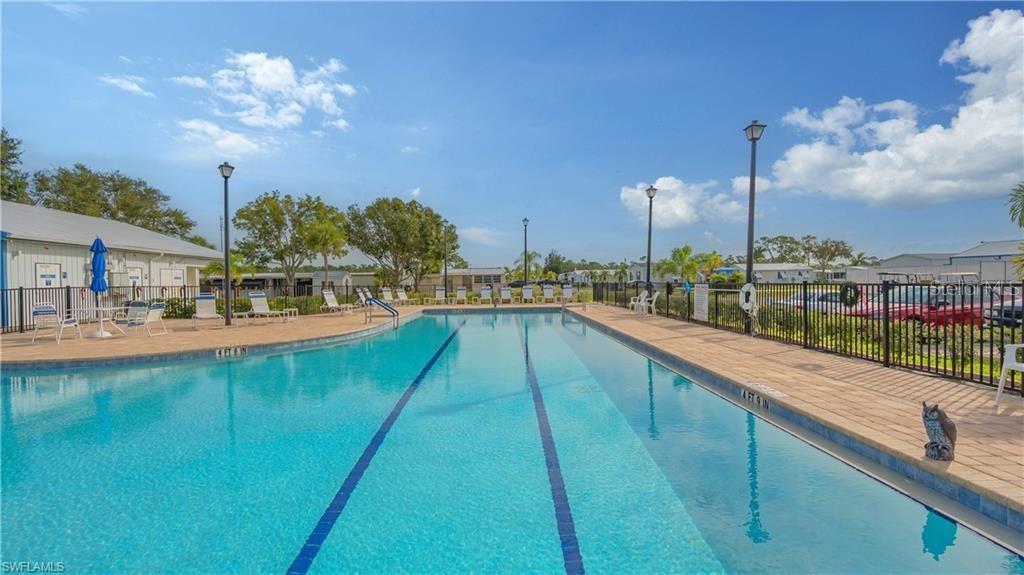 1723 East Manatee Loop Punta Gorda, FL 33950 - Photo 15 of 17 a view of a swimming pool with a lake view