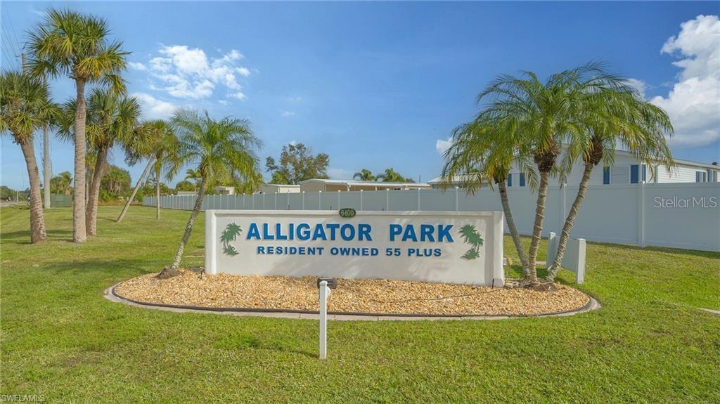 1723 East Manatee Loop Punta Gorda, FL 33950 - Photo 9 of 17 a sign on the side of the road
