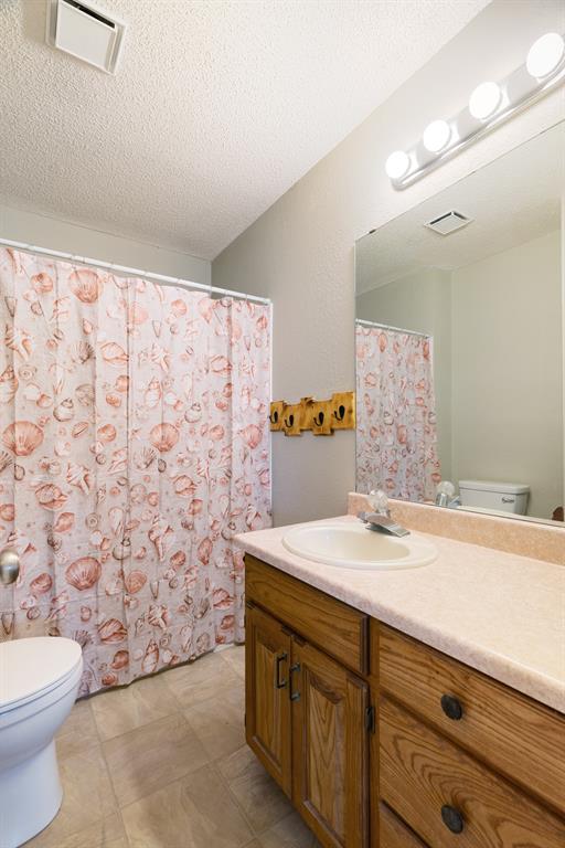 201 County Road Powderly, TX 75473 - Photo 15 of 26 a bathroom with a sink and a mirror