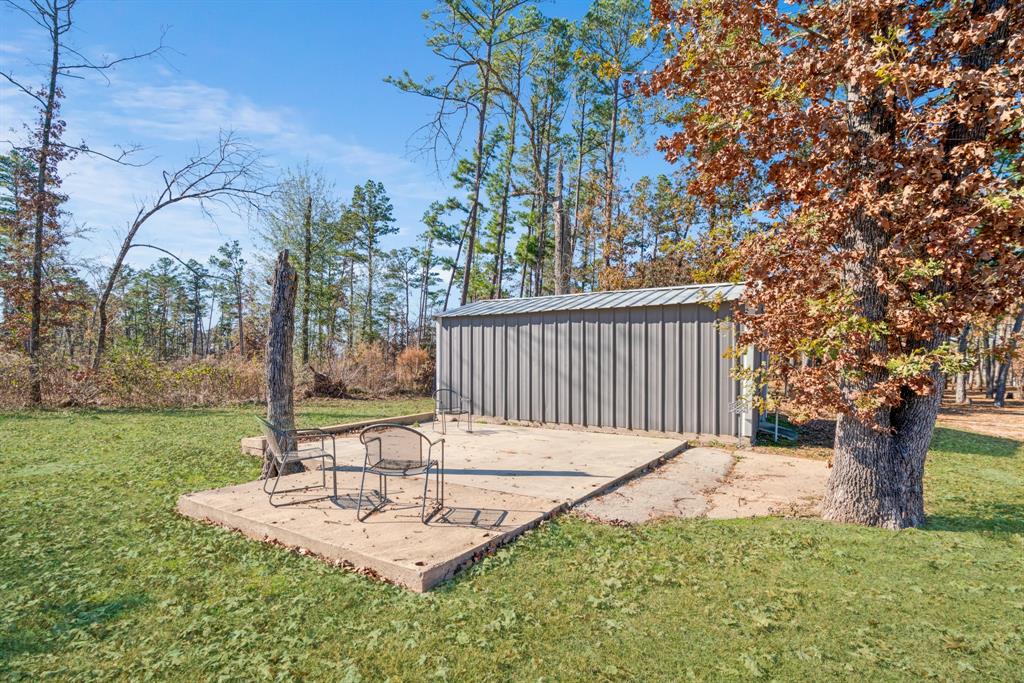 201 County Road Powderly, TX 75473 - Photo 20 of 26 a view of a backyard with tree