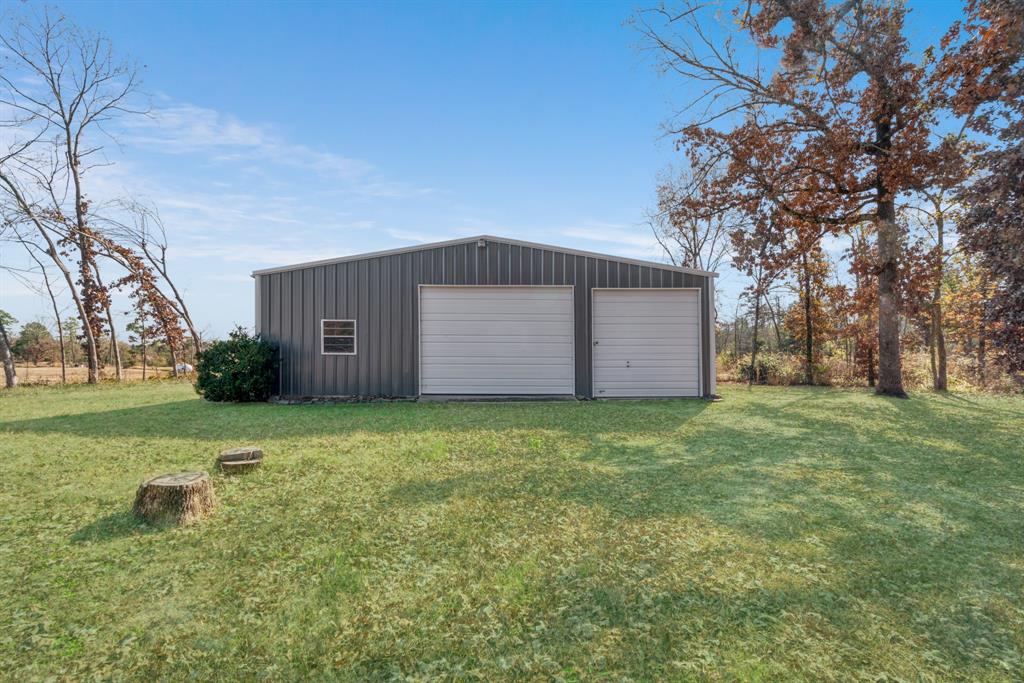 201 County Road Powderly, TX 75473 - Photo 21 of 26 a front view of house with yard and trees