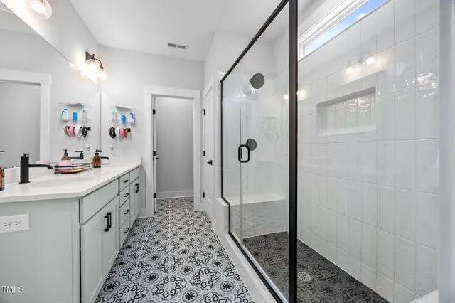 a view of walk in closet with clothes