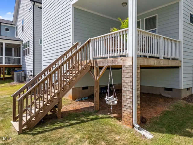 a view of a house with wooden stairs