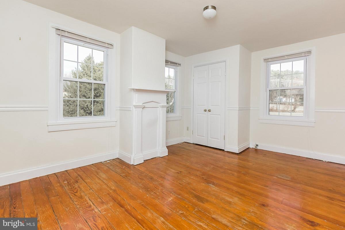 2105 Western Run Road Cockeysville, MD 21030 - Photo 9 of 12 a view of empty room with wooden floor and fan