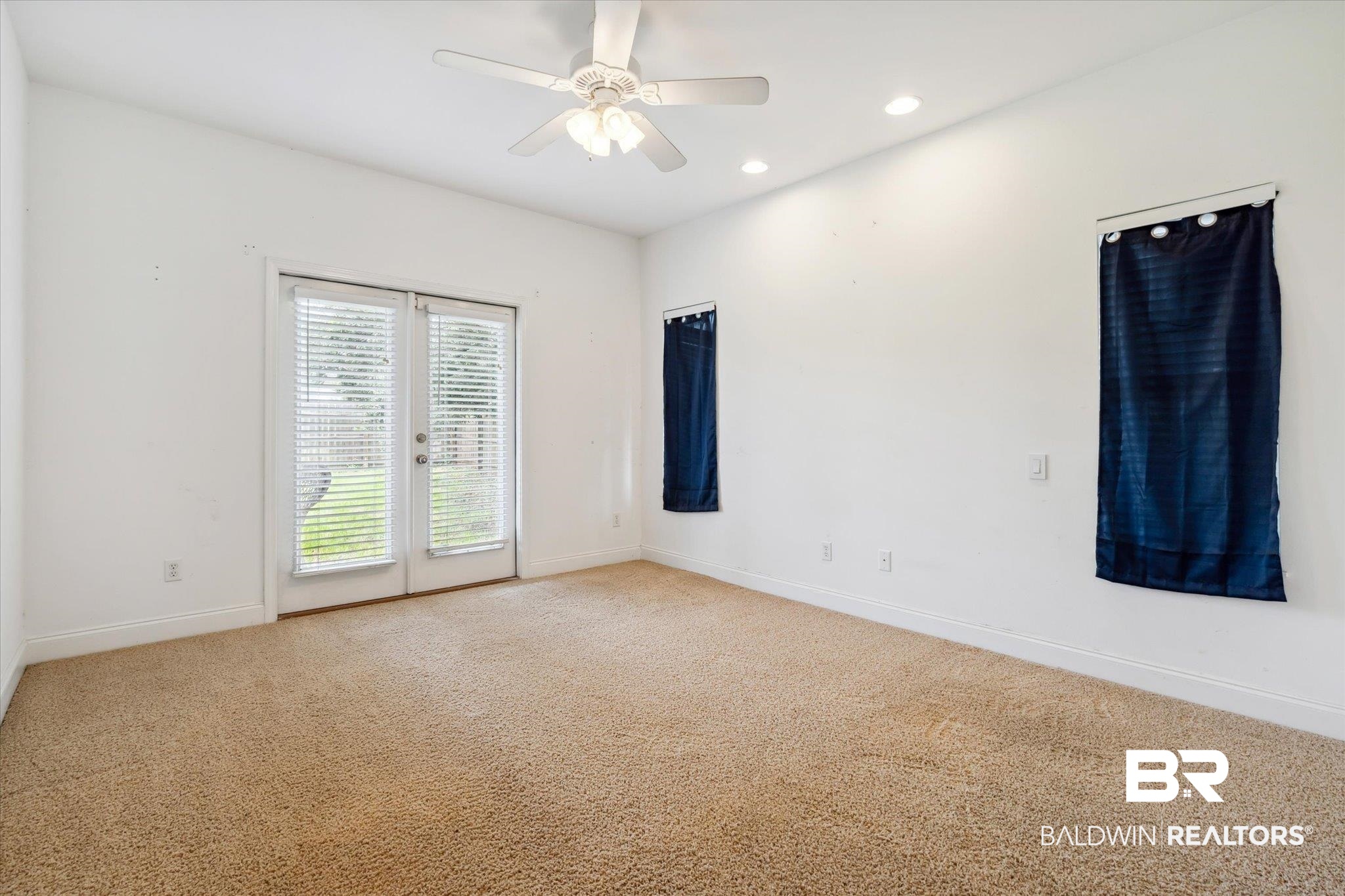 17297 Tallasee Boulevard Foley, AL 36535 - Photo 9 of 24 Carpeted spare room with ceiling fan