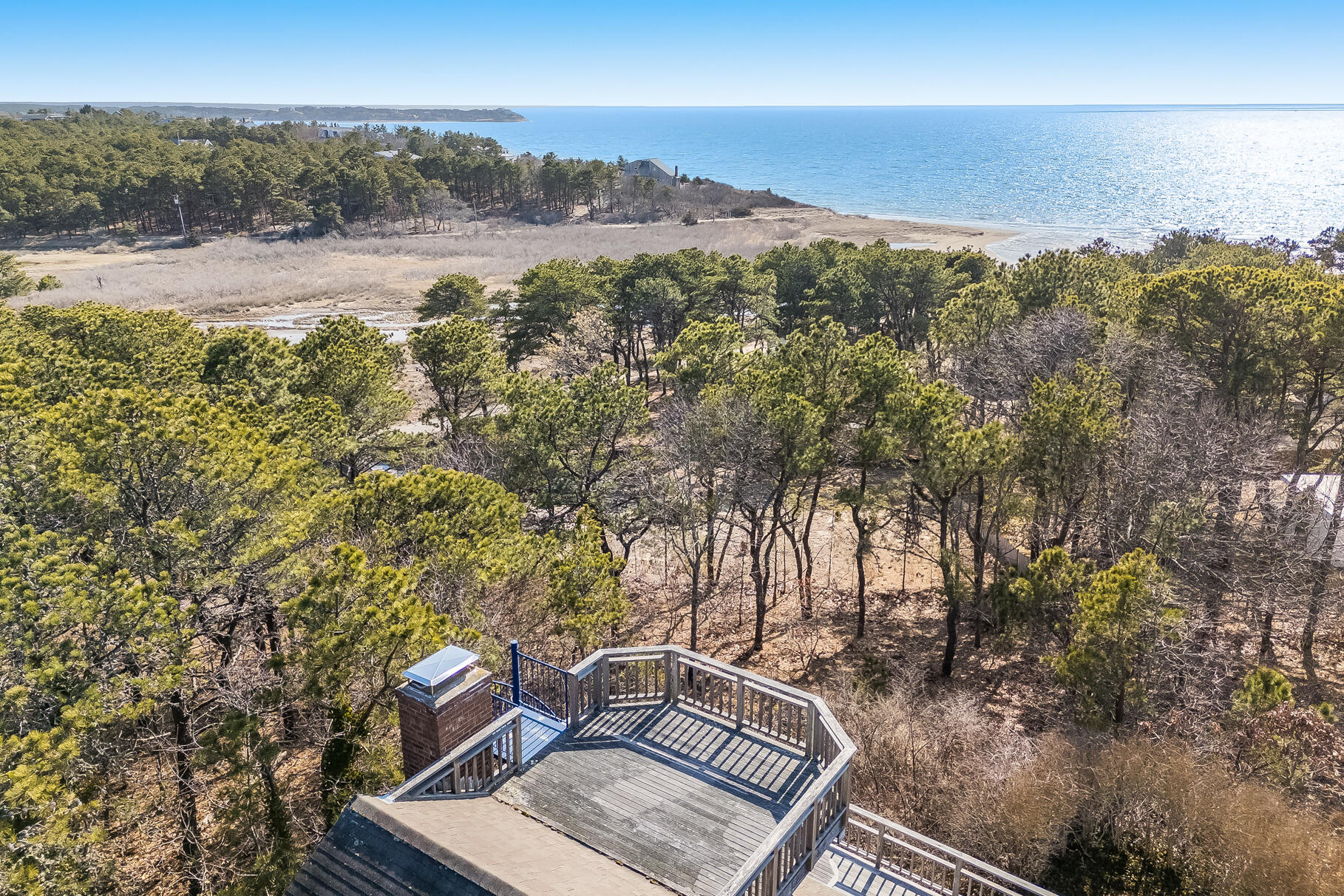 an aerial view of house with yard and mountain view in back