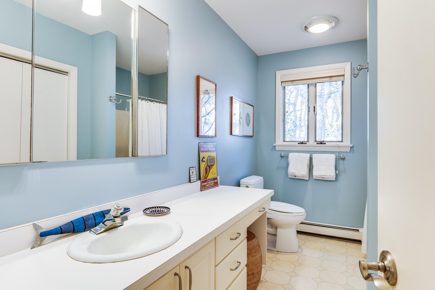 65 Massasoit Road Wellfleet, MA 02667 - Photo 19 of 86 a bathroom with a sink and a mirror