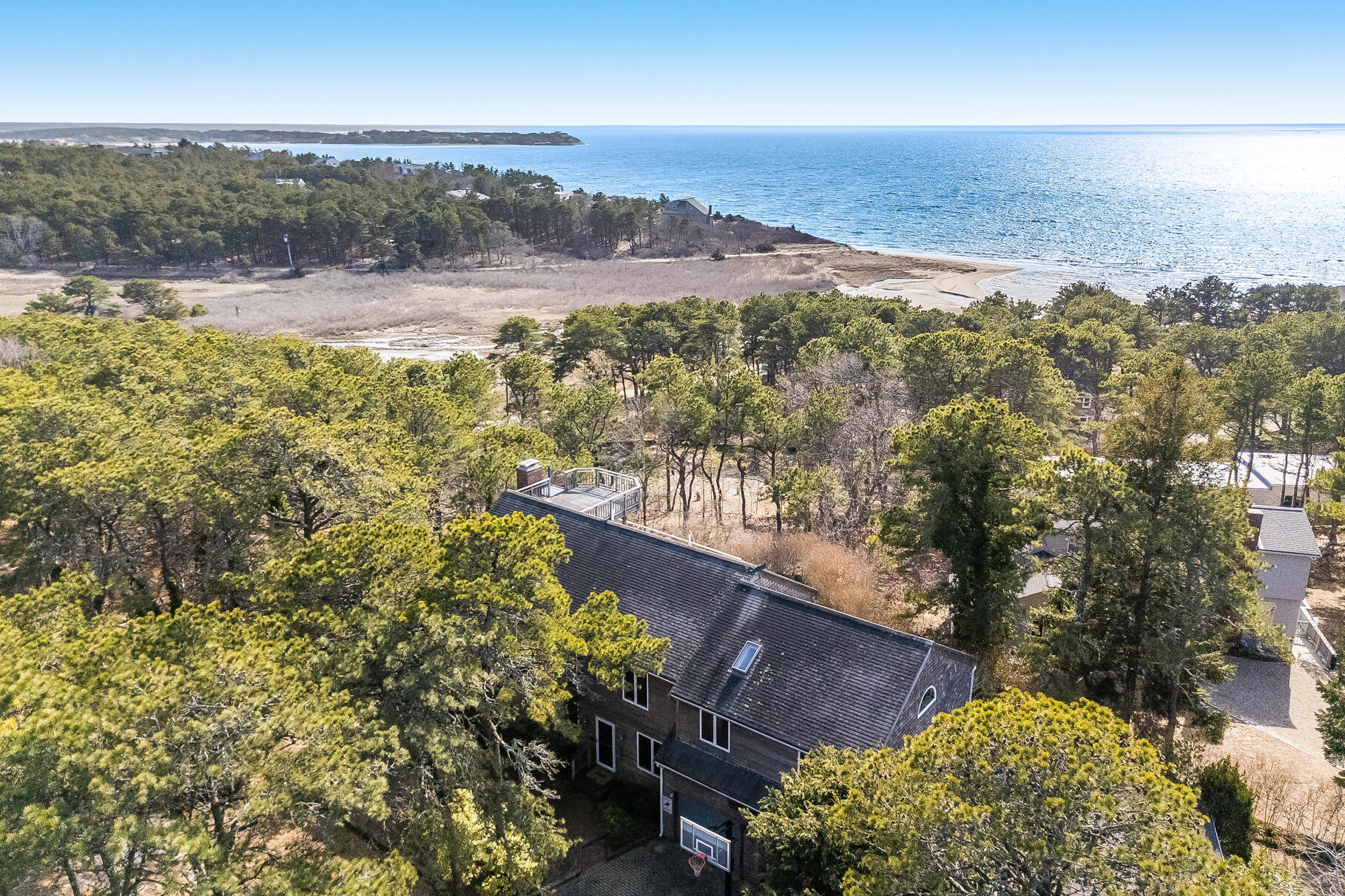 65 Massasoit Road Wellfleet, MA 02667 - Photo 2 of 86 a view of a lake with a mountain in the background