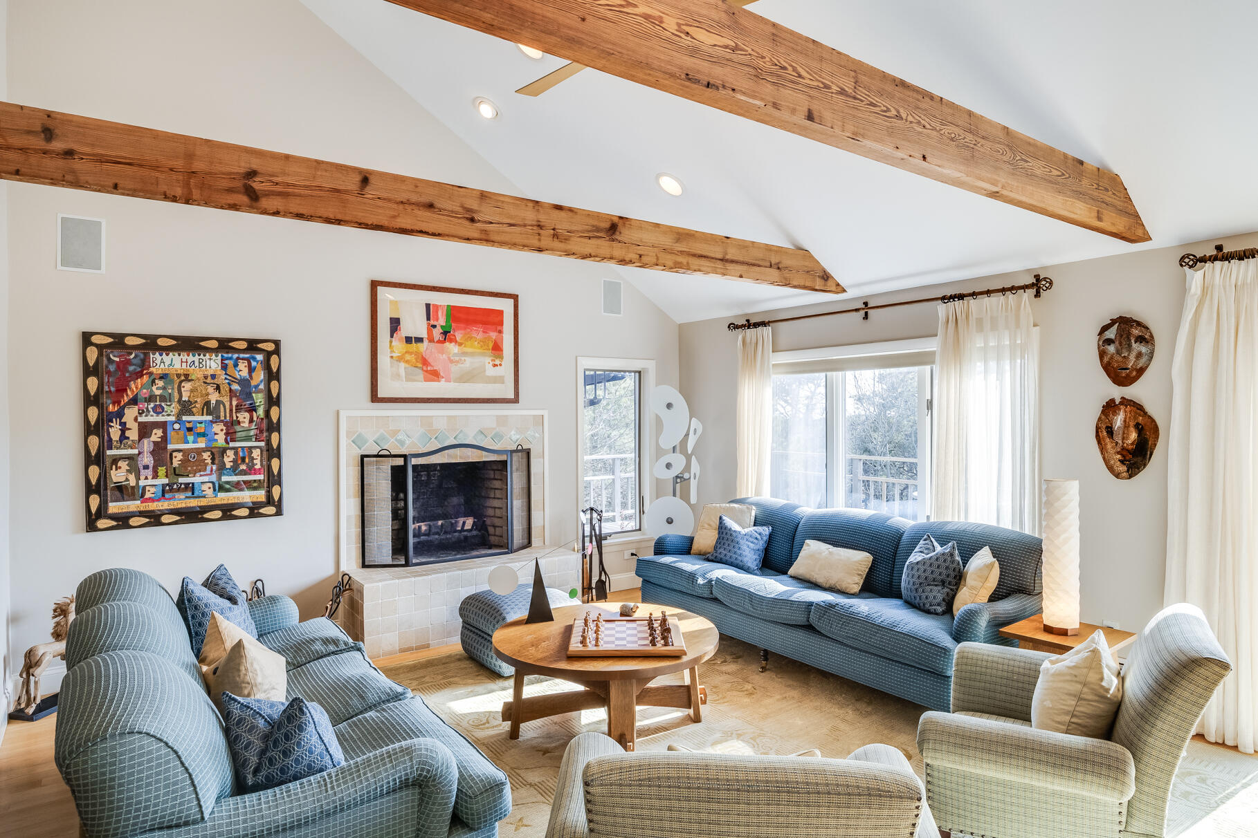 65 Massasoit Road Wellfleet, MA 02667 - Photo 30 of 86 a living room with furniture and a fireplace