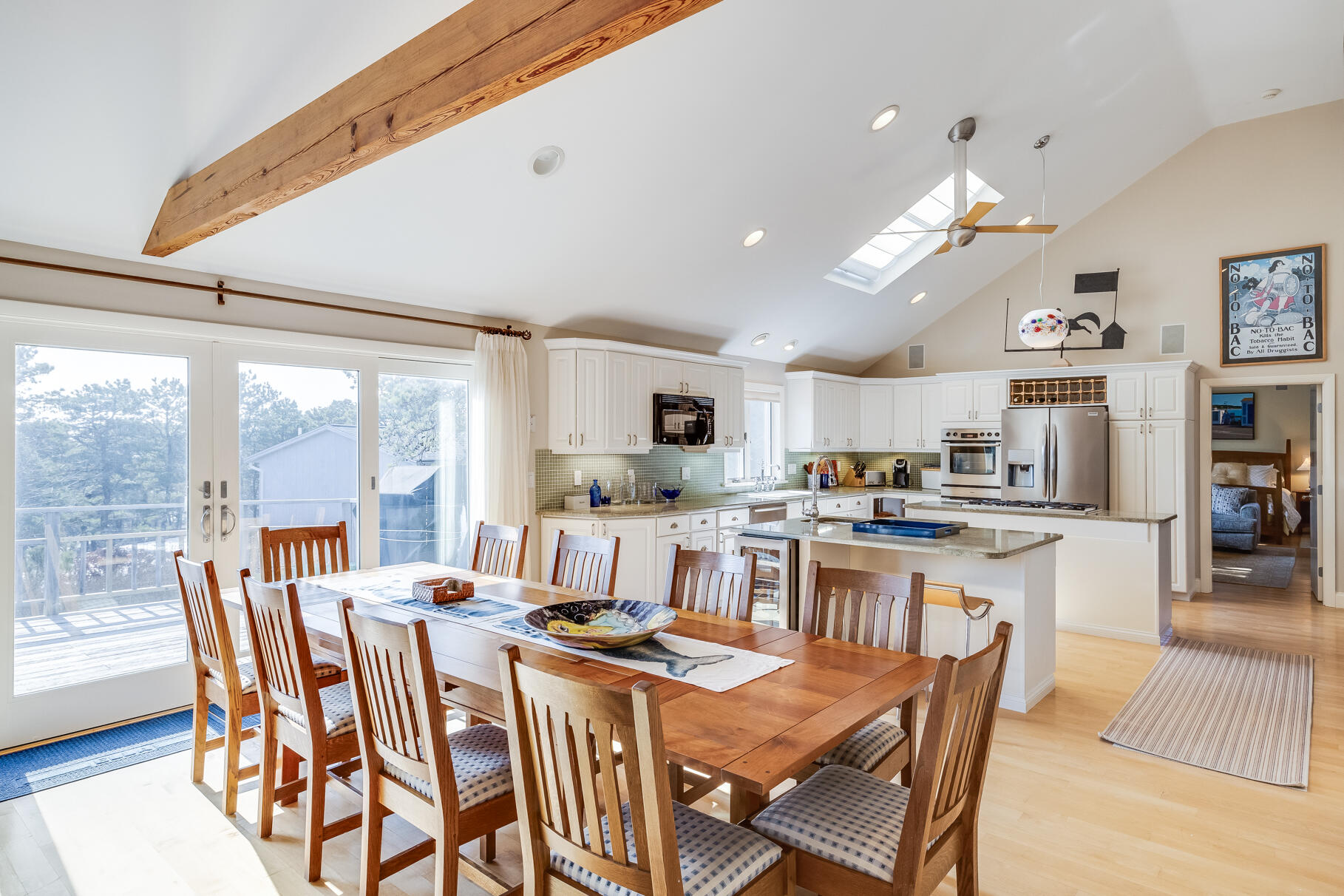 65 Massasoit Road Wellfleet, MA 02667 - Photo 33 of 86 a view of a dining room with furniture a rug and wooden floor