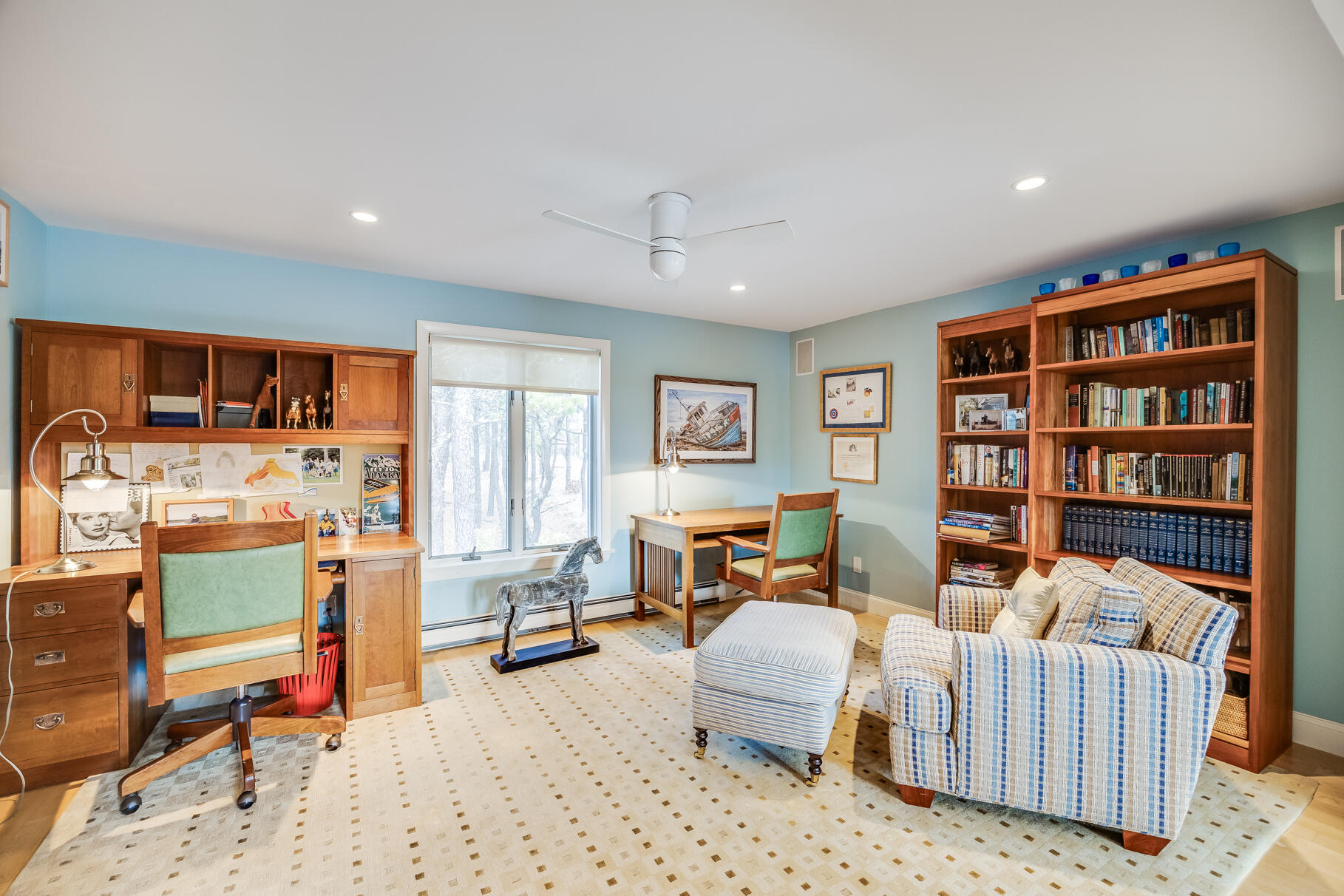 65 Massasoit Road Wellfleet, MA 02667 - Photo 39 of 86 a living room with furniture a rug and a book shelf