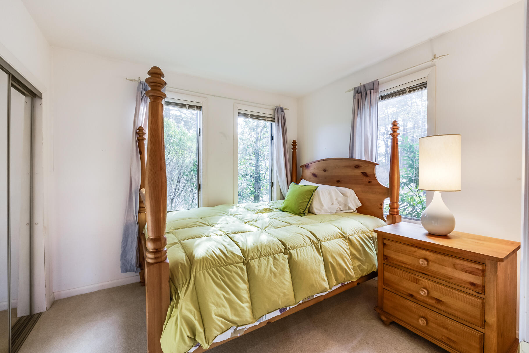 65 Massasoit Road Wellfleet, MA 02667 - Photo 56 of 86 a bedroom with a bed and wooden floor