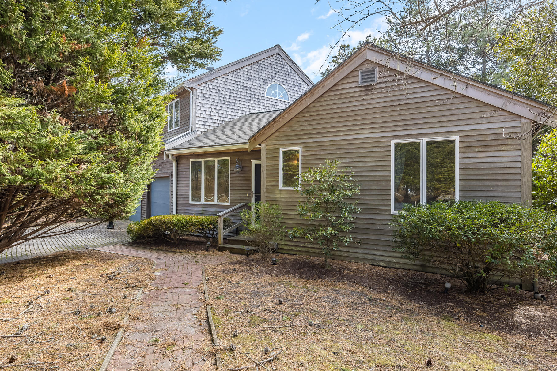 65 Massasoit Road Wellfleet, MA 02667 - Photo 7 of 86 a view of a house with a yard and plants