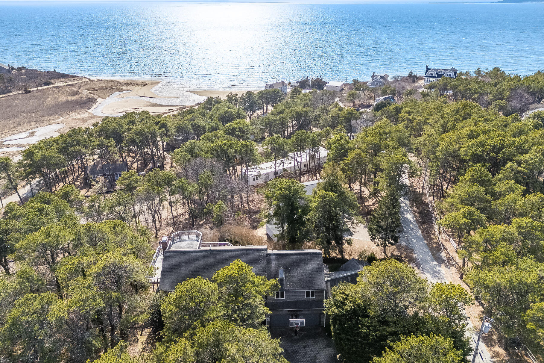 65 Massasoit Road Wellfleet, MA 02667 - Photo 71 of 86 a view of a lake with a mountain in the background