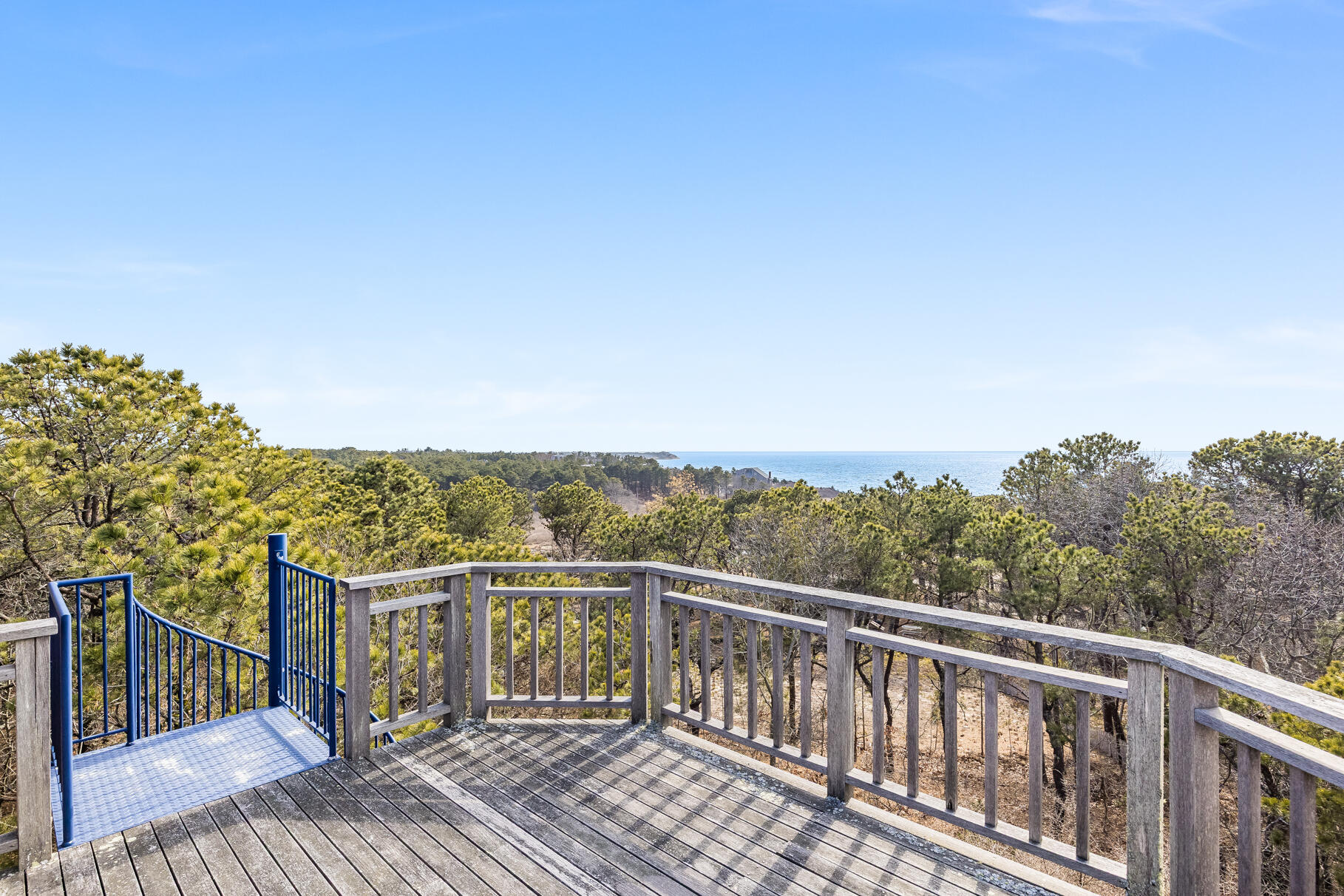 65 Massasoit Road Wellfleet, MA 02667 - Photo 79 of 86 a view of a balcony with wooden floor and fence