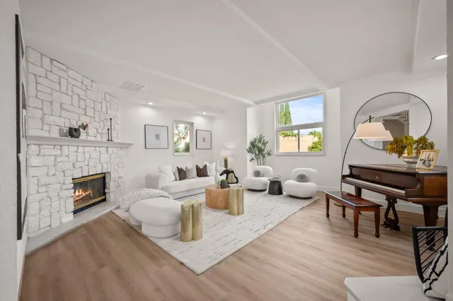 a living room with furniture kitchen and a window