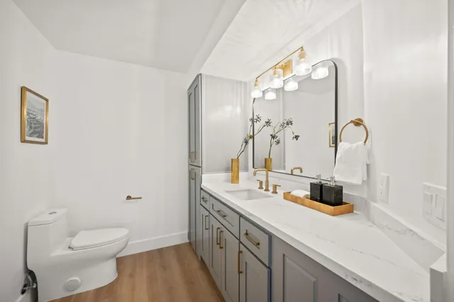 a kitchen with a sink a counter top space stainless steel appliances and a window