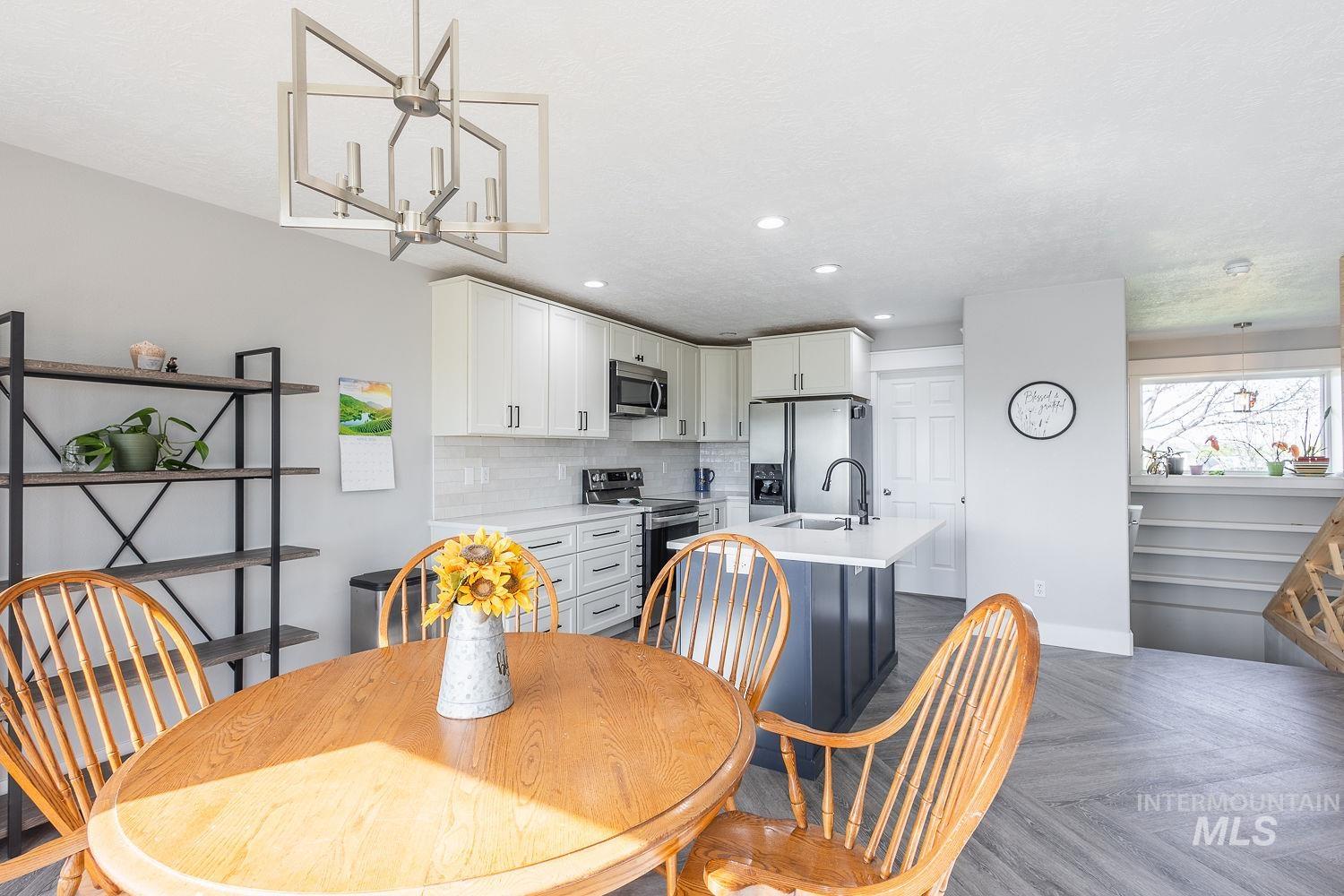 3950 Cassia Road New Plymouth, ID 83655 - Photo 13 of 26 Dining room with parquet flooring and recessed lighting