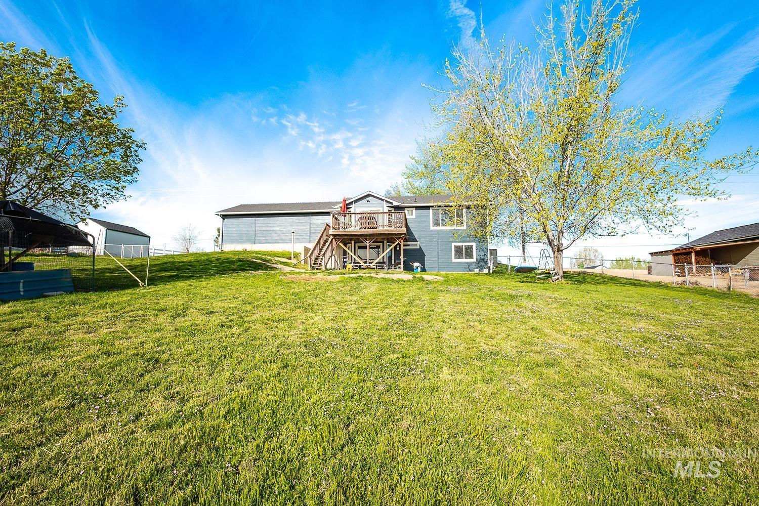 3950 Cassia Road New Plymouth, ID 83655 - Photo 4 of 26 Rear view of property featuring stairway and a deck