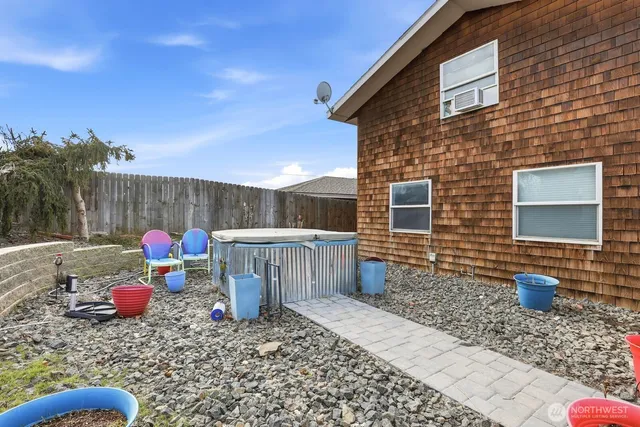 a view of a patio with a dining table and chairs with a patio