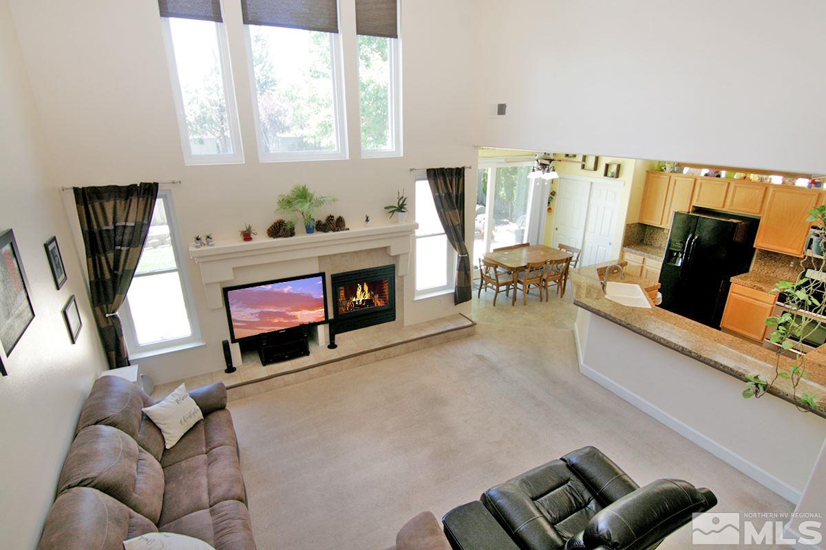 9585 Apache Rose Drive Reno, NV 89521 - Photo 10 of 28 a living room with furniture and a fireplace