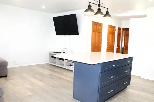 a living room with couches and flat screen tv